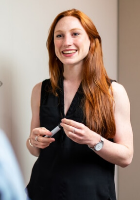 Portrait of Jill Adams, Branding Specialist, presenting with a warm smile in a professional setting.